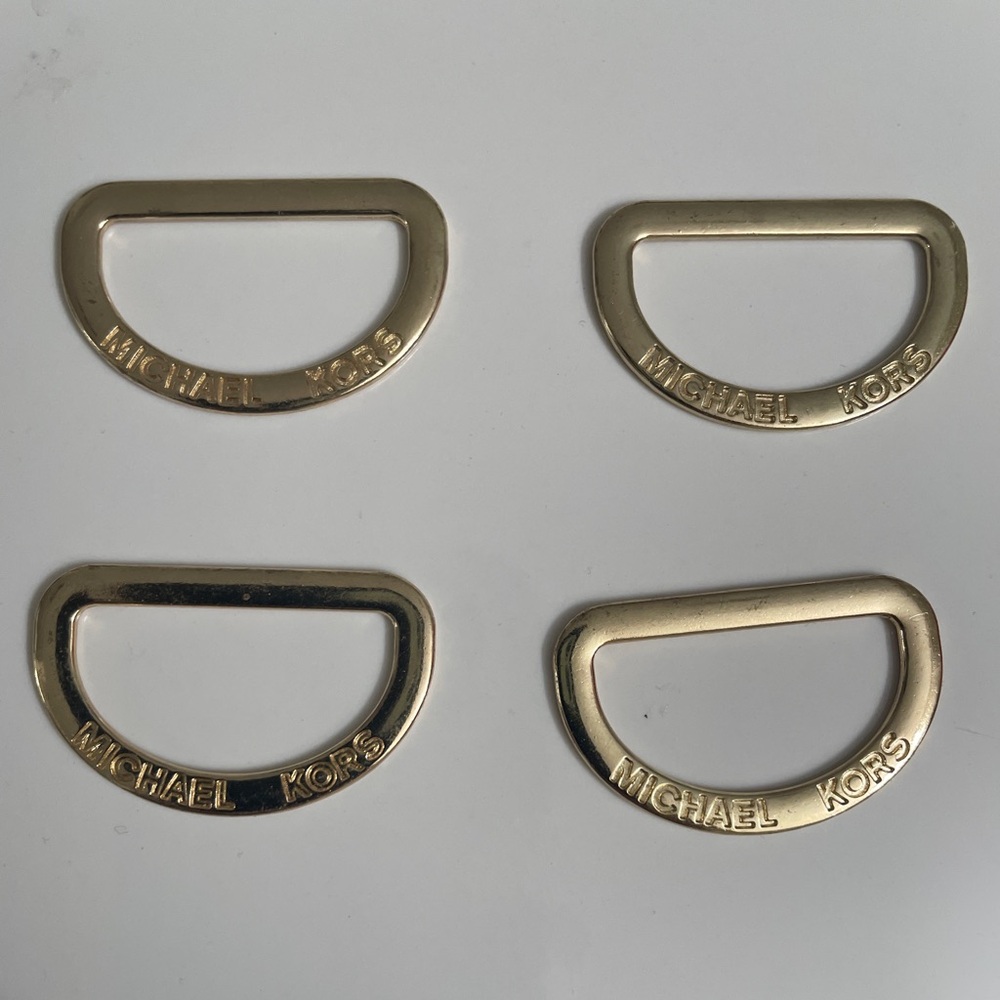 Michael Kors Gold Tone sleeve tabs